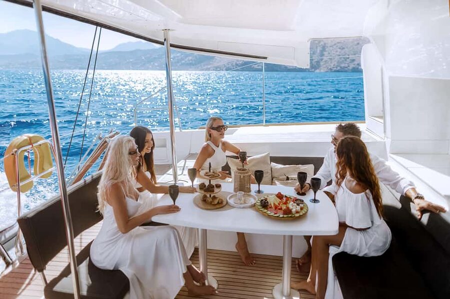 Agios Nikolaos All-inclusive Catamaran Cruise & Water Toys - Spinalonga stop: photos, sightseeing, and cheese tasting timing