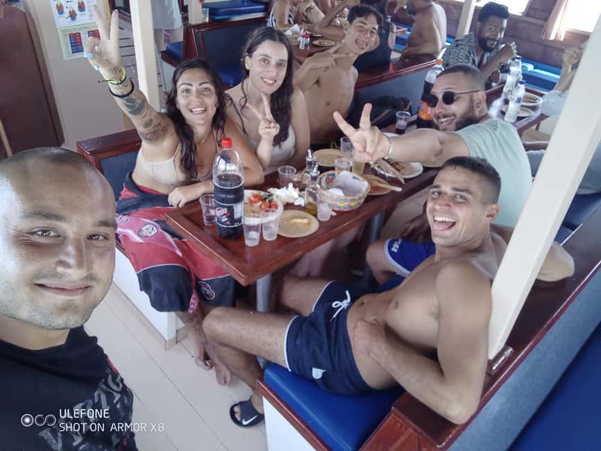 Argostoli: Full-Day Boat Cruise with Lunch - Onboard life with Artemis Express: crew, drinks, and the water slide