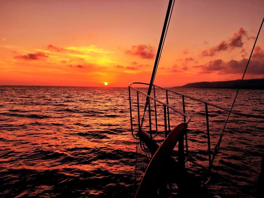 Argostoli: Sunset Cruise with Swim Stops, Dinner, and Wine - Xi Beach red-brick sand versus Livadi: the weather-linked swim choice