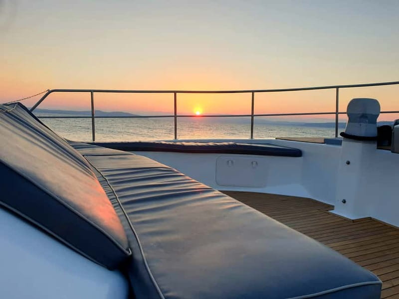 Back to the '80s Disco Cruise Ammouliani Round Tour - A neon-soaked sunset from Ouranoupolis