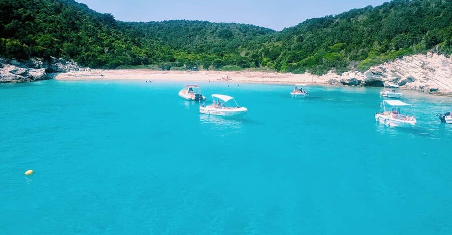 Corfu: Paxos Island Full-Day Cruise with Blue Caves - Blue Caves in Paxos: Clear Blue-Green Water and a Guided Moment