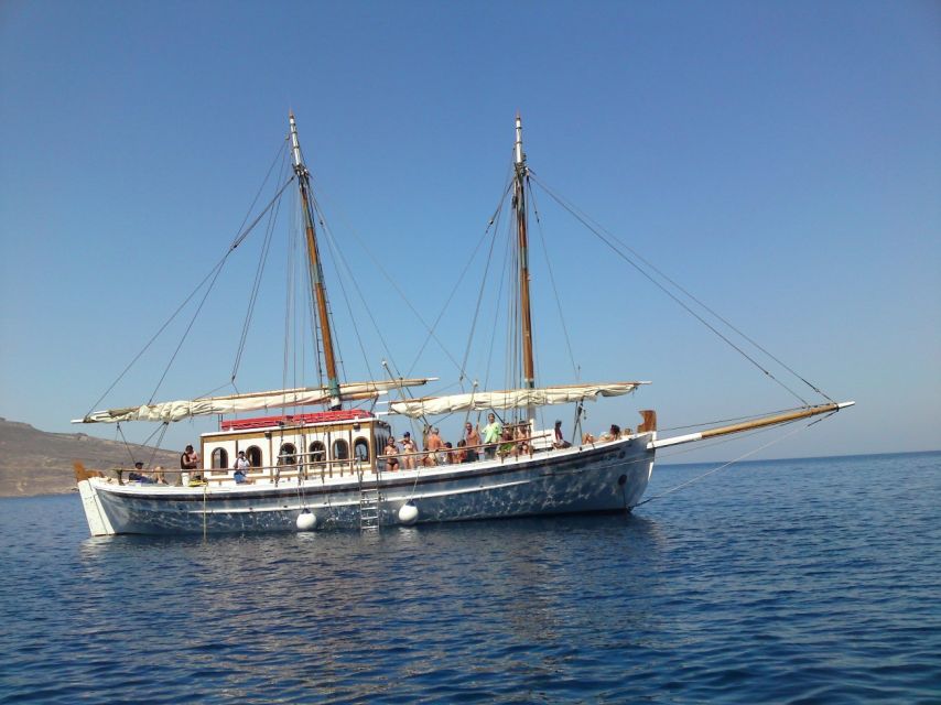 Corfu Town: Full-Day Cruise with Lunch, Drinks & Swim Stops - East Coast Pass-By Views: Fishing Harbor, Villa Stories, and Tower Lines