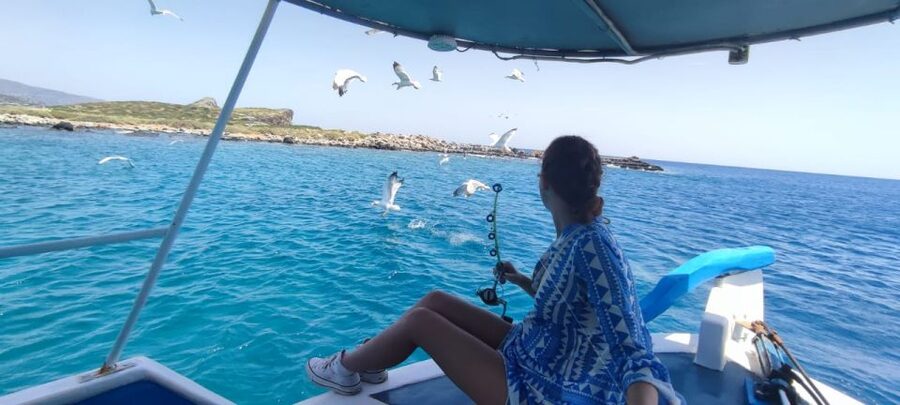 Crete: Fishing & Swimming Boat Cruise with Lunch & Drinks - Sea Caves, Snorkeling, and the Elounda Bay Swim Stops