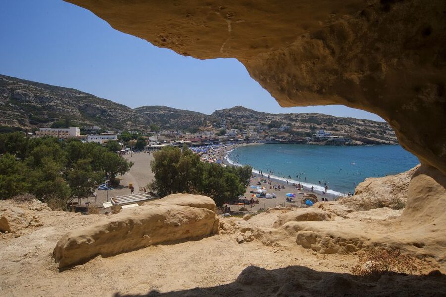 Crete: Matala Beach and Hippie caves, Red beach - Matala Beach and the hippie caves, ancient tombs made into folklore