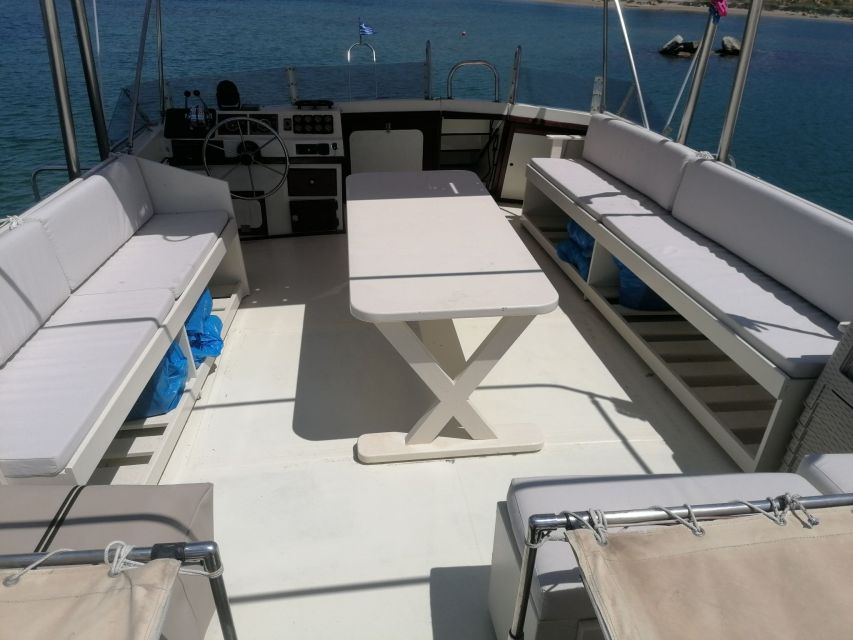Crete: Snorkeling Boat Trip with Lunch and Transfer - Saint George Bay: Sunbathing in a Rocky, Green-Coast Setting