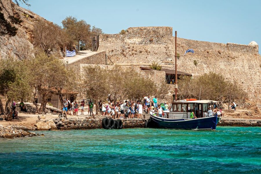 Elounda: Spinalonga Guided Boat Tour with BBQ and Swimming - Elounda at the End: A Photo Stop and Bayside Perspective