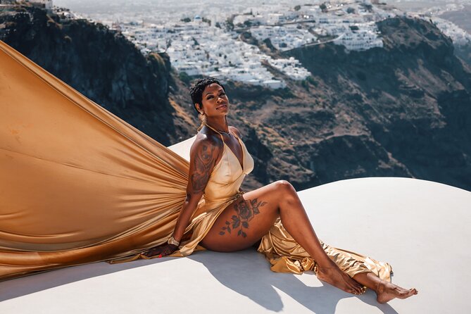 Exclusive Santorini Flying Dress Photoshoot with Pickup - Stop 1 in Imerovigli: blue domes, rooftops, and volcano views