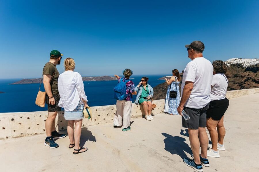 Fira: Guided Foodie Walking Tour with Tastings - Market Time and a Midday Tavern Meal With Caldera Views