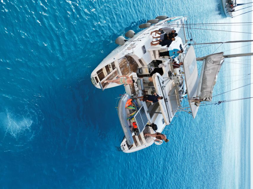 From Adamas: Milos and Poliegos Catamaran Cruise with Lunch - Poliegos: a quieter, uninhabited island swim with snorkeling built in