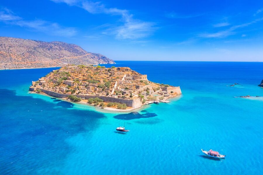 From Ag. Nikolaos: Spinalonga & Kolokytha Cruise with Lunch - Spinalonga Island: fortress walls, a former leper colony, and smart self-guided time