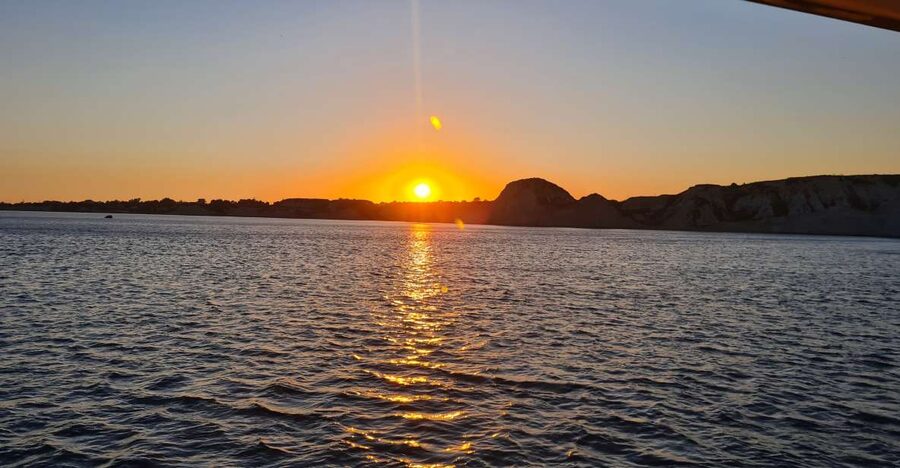 From Argostoli: Vardiani Island Sunset Cruise & Greek Meze - Xi Beach at night: the red-sand legend and the magic of swimming in darkness