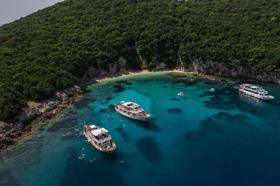 From Benitses/Lefkimmi: Blue Lagoon & Papanikolis Cruise - The onboard tour and languages: what you’ll hear and what you might not