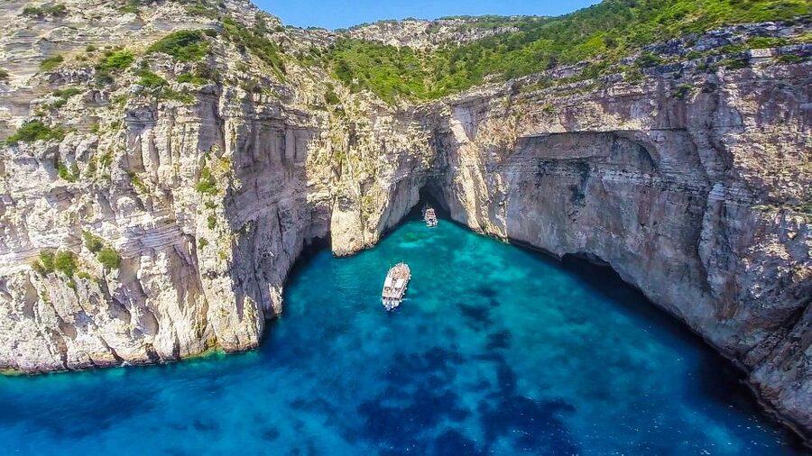 From Corfu: Day Cruise to Paxos, Antipaxos, and Blue Caves - Sailing Into the Ionian Sea: Corfu Old Town Views While You Get Moving
