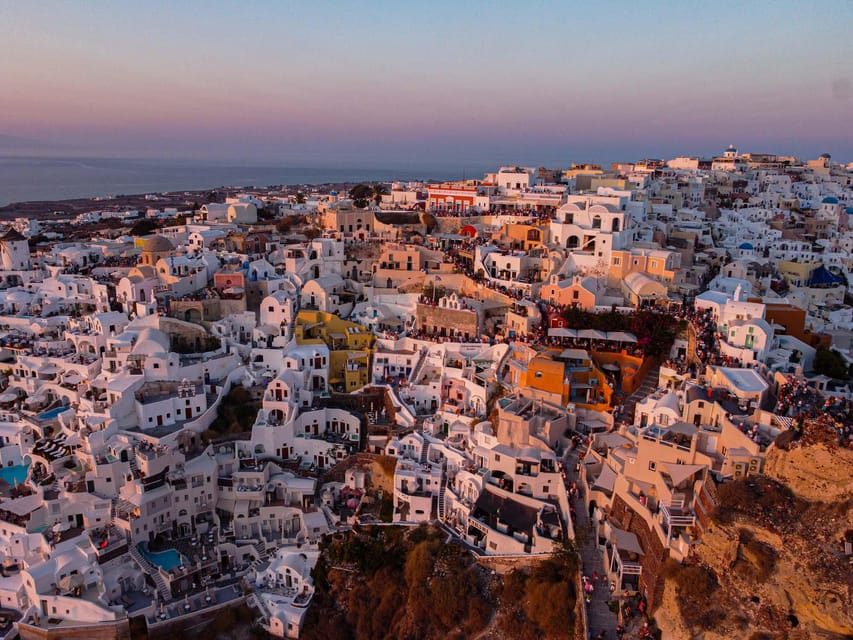 From Fira: Santorini Highlights Minibus Tour with Oia Sunset - Firostefani: The Blue Domes Walk and a Lighthouse Photo Moment