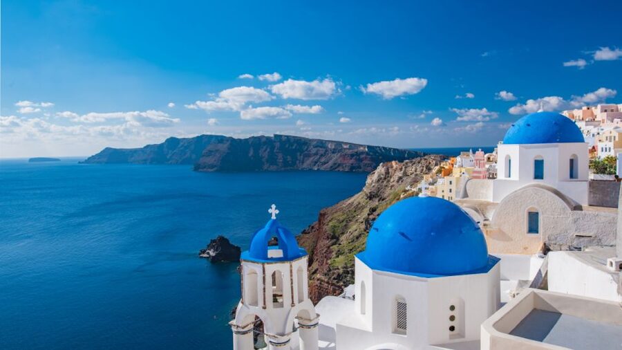 From Heraklion/Crete: Santorini Island Guided Day Trip - The Fira Cliffside Feel: Blue Domes, Shops, and Panoramic Stops