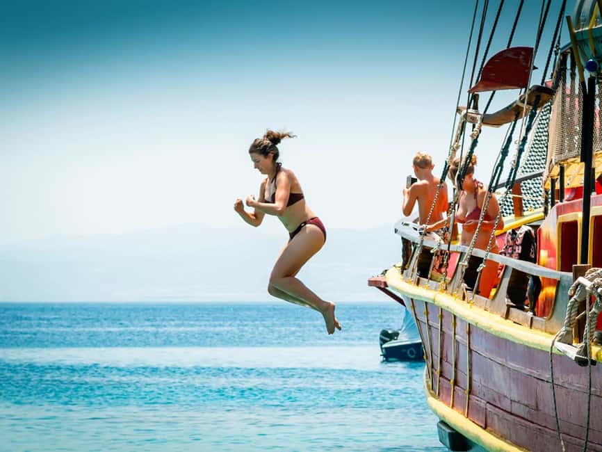 From Hersonissos: Half-Day Pirate Boat Trip with Lunch - Lunch on Board: pork steak, tzatziki, and what to expect