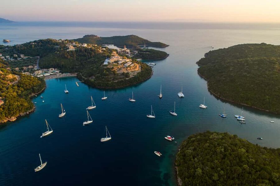 From Lefkimmi: Syvota, Blue Lagoon and Cave Sunset Cruise - First stop: entering Sivota Cave by boat for those up-close rock views