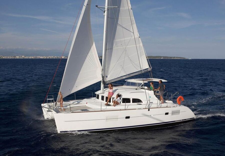 From Ornos: Mykonos Delos Catamaran Cruise with Meal & SUP - The Mykonos Return: Windmills and Coastline Views