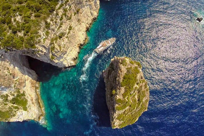 Full-Day Boat Tour of Paxos Antipaxos Blue Caves from Corfu - Onboard Comfort, Shade, Music, and Multi-Language Guidance