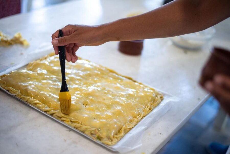 Greek Cooking Class with a Local Chef, Wine, & Meal in Drios - Welcome Aperitif of Greek Wine and Souma