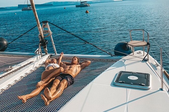 Half-Day Exclusive Catamaran Cruise in Santorini with Meal and Open Bar - Red Beach, White Beach Pass-By, and the Venetian Lighthouse Story