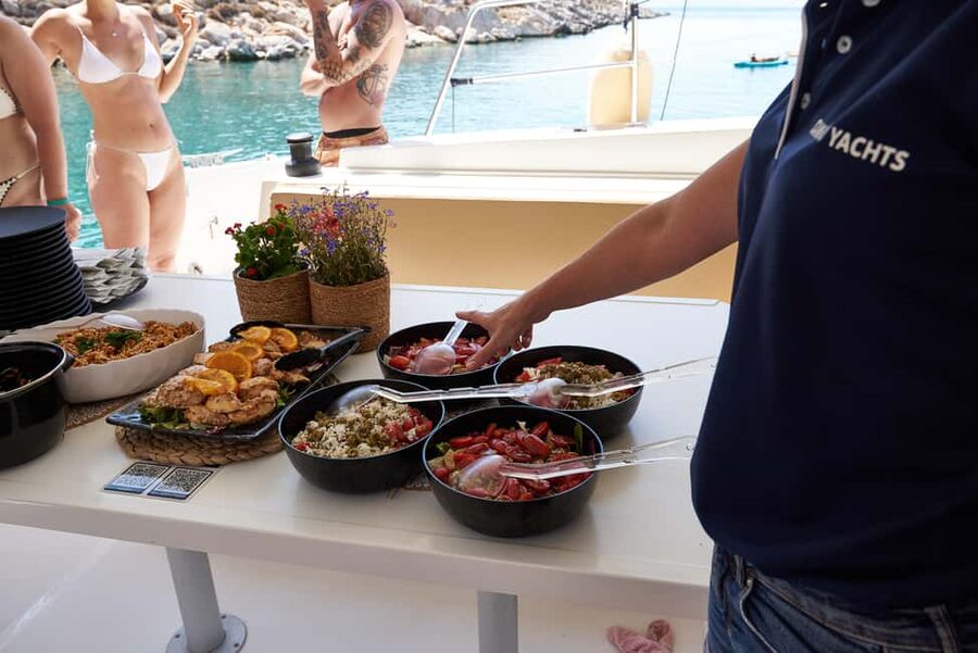 Hersonissos: Dia Catamaran Cruise with Lunch & Drinks - Lunch on board: Cretan flavors with kid-friendly options