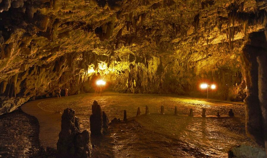 Kefalonia: Island Sightseeing Bus Tour with Hotel Transfer - Melissani Cave boat ride: color changes, crowds, and no swimming rules