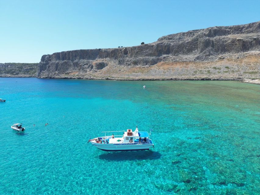 Lindos,Pefkos: All inclusive Swim & Snorkel Boat Cruise - Stop 1: Lindos cave swimming, where the water turns spooky-good