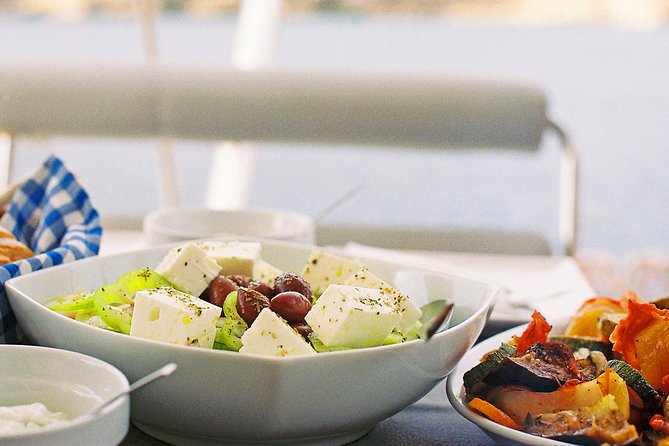Luxury Catamaran Cruise from Athens with Traditional Greek Meal and BBQ - Morning lunch cruise vs sunset dinner cruise, and how the vibe changes