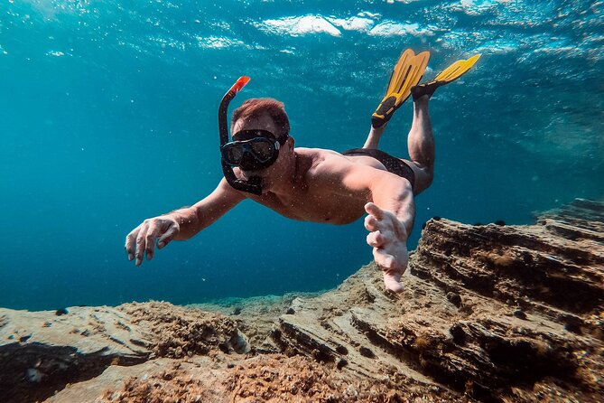 Luxury Santorini Sunset Cruise: Dinner, BBQ, Open Bar, Transfers - Mesa Pigadia Beach: swim and snorkel time in the southern water
