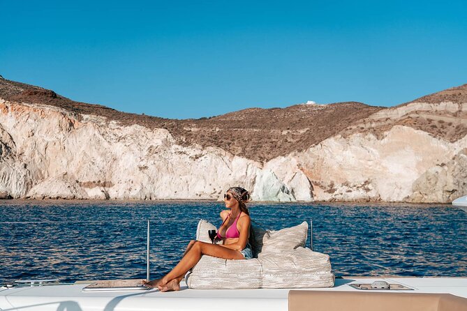 Luxury Santorini Sunset Cruise: Dinner, BBQ, Open Bar, Transfers - Sailing past Red Beach, White Beach, and the Akrotiri lighthouse