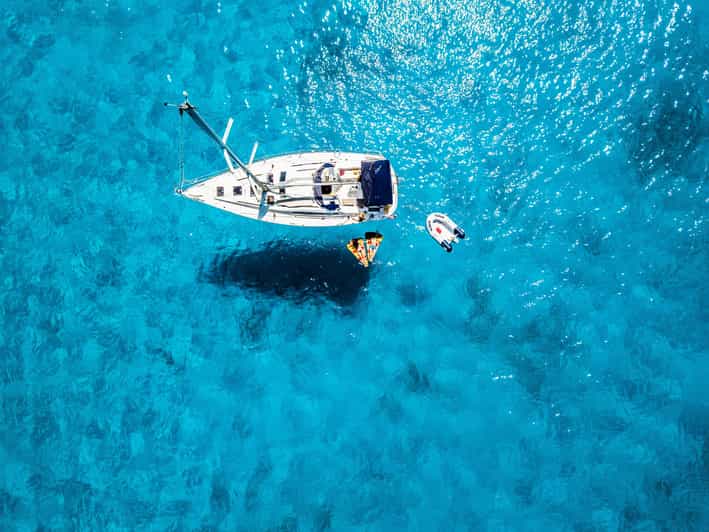 Milos: Full-Day Kleftiko Poliegos Sailboat Tour with Lunch - Gerakas Beach lunch, then hot-spring soaking