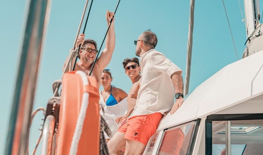 Milos: Full Day Luxury Catamaran with Full Meal & Open Bar - Triades Beach: quick reset with swim, snorkel, and SUP