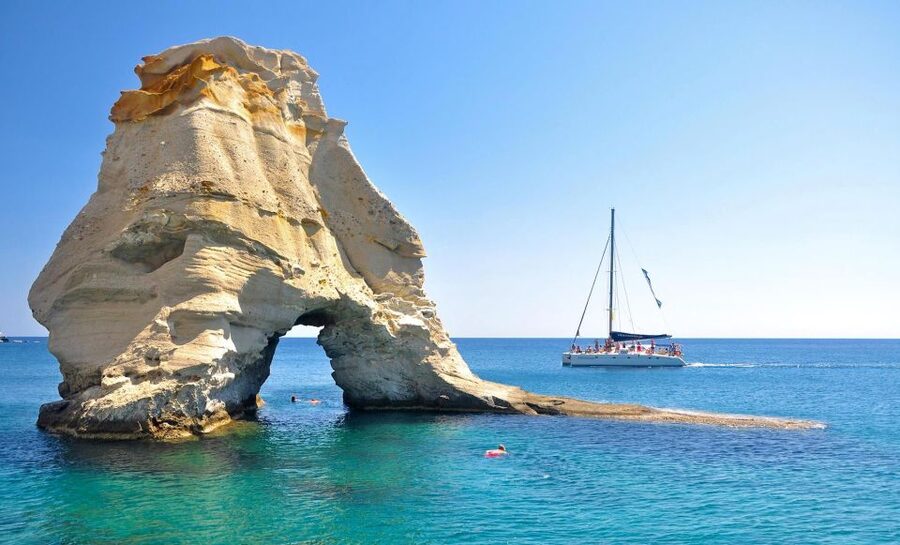 Milos: Half-Day Morning Catamaran Cruise to Kleftiko - Drinks, music, and the crew vibe on a small catamaran