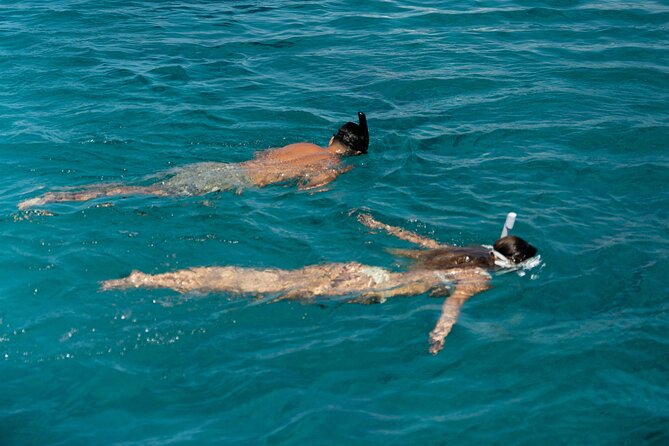 Mykonos: Brand-New Catamaran Cruise with Meal, Drinks & Transport - Rineia stop: swim, snorkel, and play with the water toys