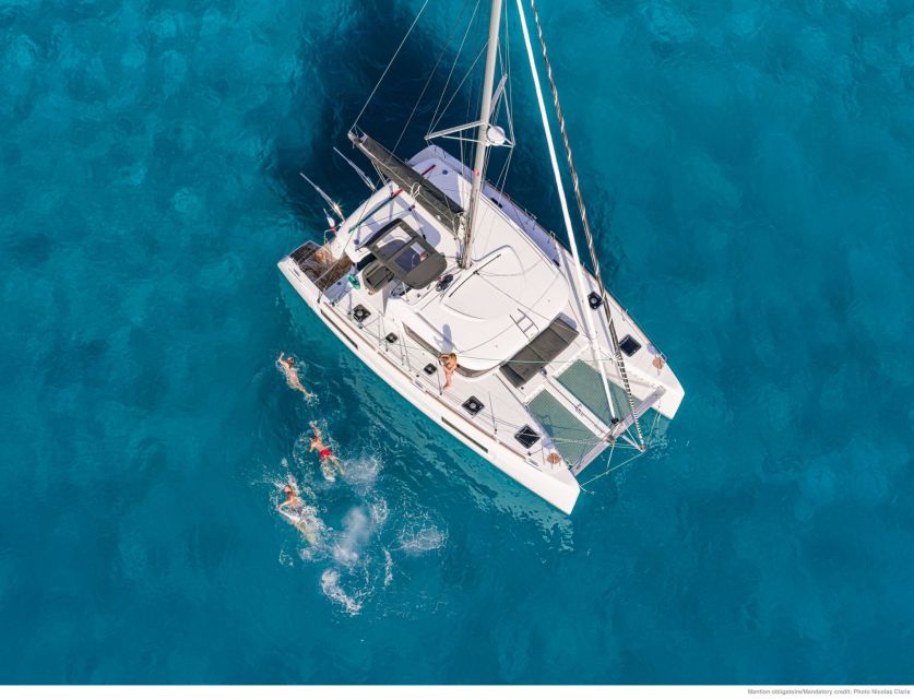 Mykonos: Catamaran Cruise with Lunch, Drinks and Transfer - Delos from the water: photos, no landing, and why it still matters