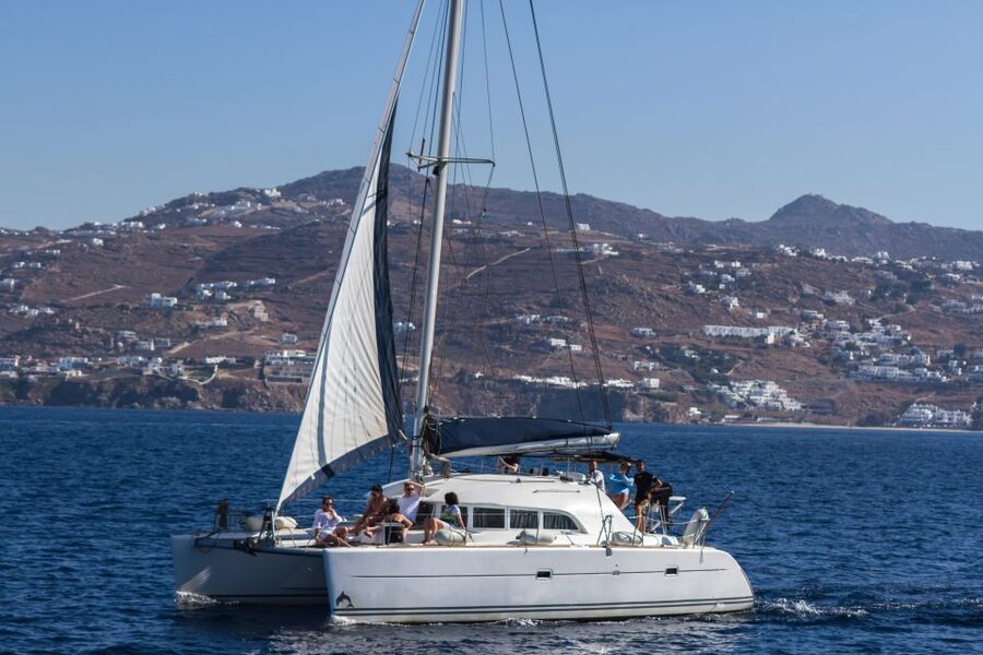 Mykonos: Catamaran Cruise With Meal and Drinks - Getting picked up from your hotel, then out to the water fast