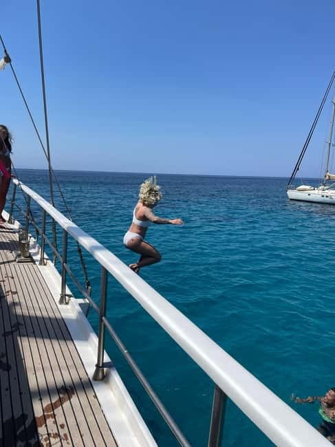 Mykonos: Delos and Rhenia Islands Cruise with BBQ Meal - Rhenia Island: BBQ lunch, drinks, and open-water downtime