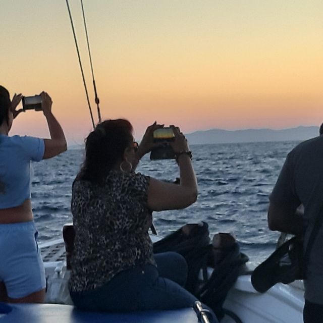 Mykonos: Sunset Boat Trip with Snacks and Drinks - Snacks, drinks, and the mood shift into vacation mode