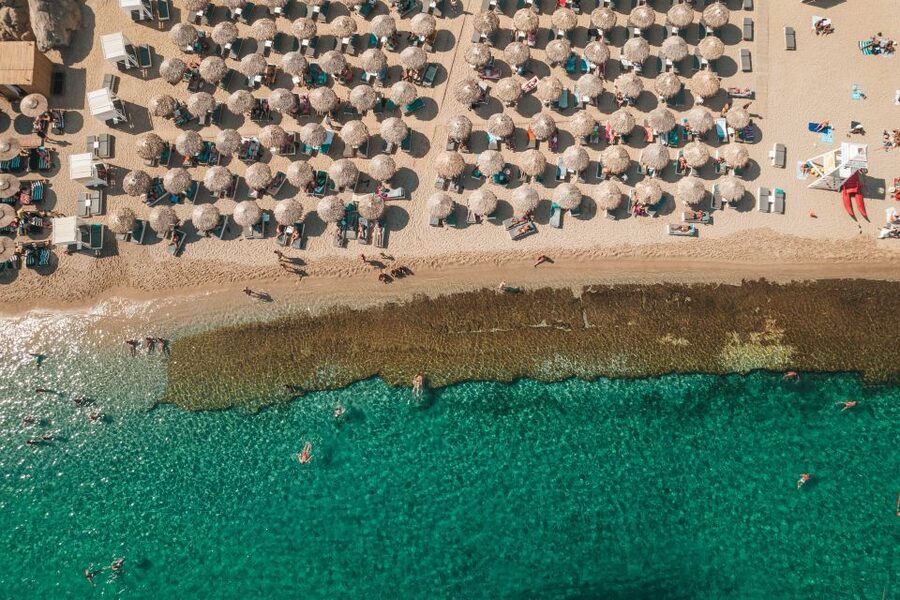Mykonos: Super Paradise Beach with Sunbed at Thalas Mykonos - The shoreline is rocky: water shoes are your best friend here