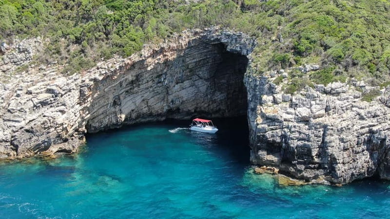 Paleokastritsa: Paradise, Yali Beach & Blue Caves Boat Tour - Stop 1: Sea caves near Paleokastritsa, where the rocks do the talking