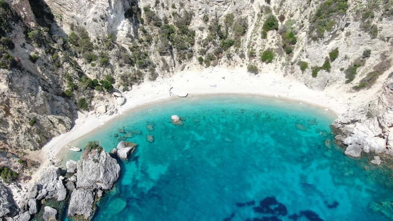 Paleokastritsa: Paradise, Yali Beach & Blue Caves Boat Tour - Paradise Beach (Chomi): short, regulated swim time in a boat-only cove