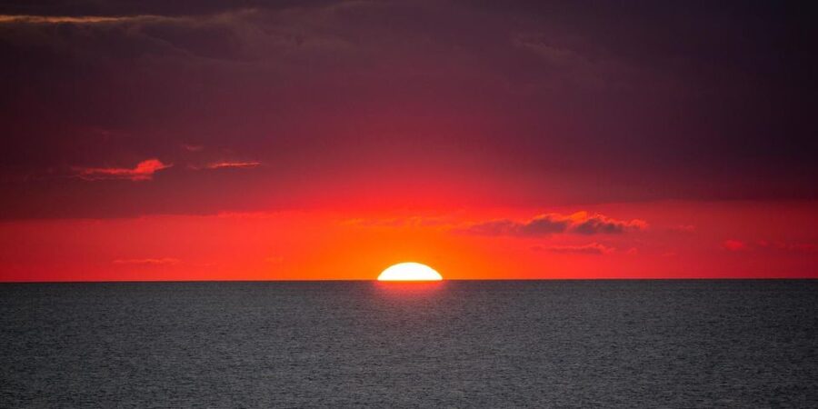 Paros: Sunset Boat Tour to Antiparos with Wine - Despotiko ruins: the moment the light becomes the main attraction