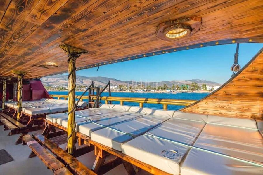 Pirate Cruise from Kos to Kalymnos, Pserimos, Plati & BBQ - Kalymnos Pothia town time, rugged coastline views, and maritime energy
