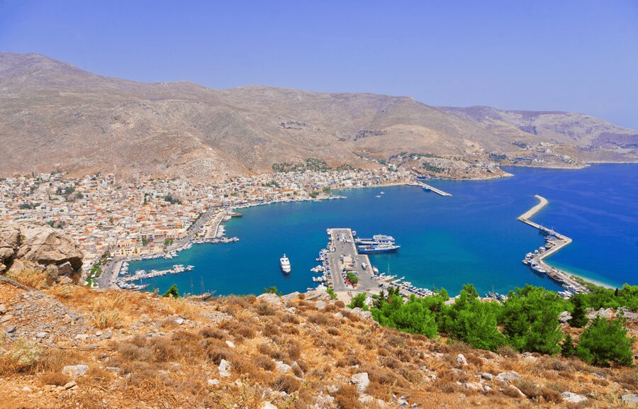 Pirate Cruise from Kos to Kalymnos, Pserimos, Plati & BBQ - Stop 3: Plati cocktails, sunbathing, and clear-water fun
