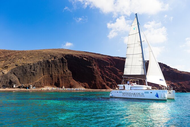 Premium Small-Group Catamaran Cruise with BBQ, Open Bar, Transfer - Entering Santorini by boat from Vlychada