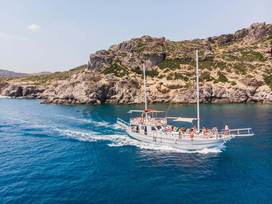 Rhodes: Boat Tour with Snorkeling, Gourmet Buffet & Open Bar - Open bar, music, and the onboard vibe you should expect