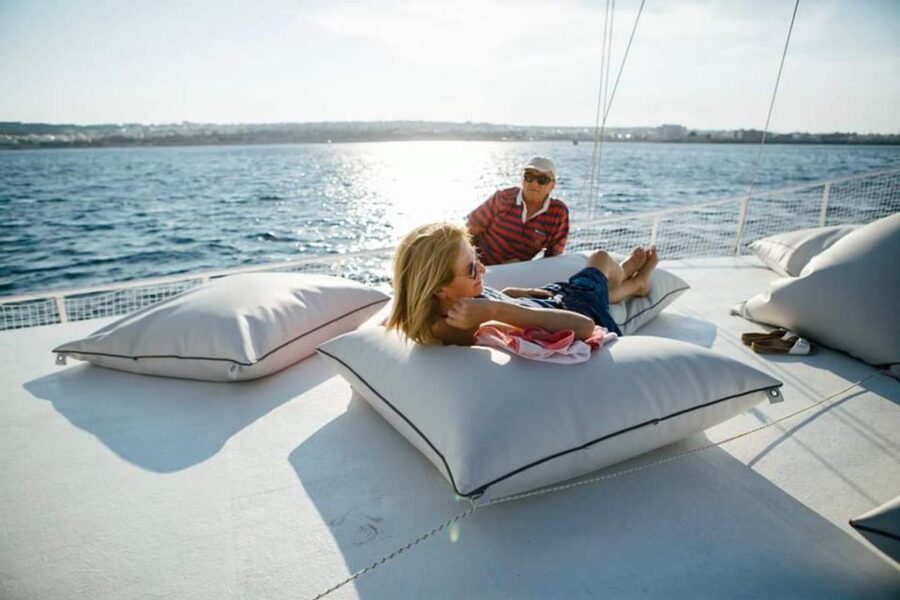 Rhodes: Boat Tour with Snorkeling, Gourmet Buffet & Open Bar - The anchored-bay reality: you reach shore by swimming