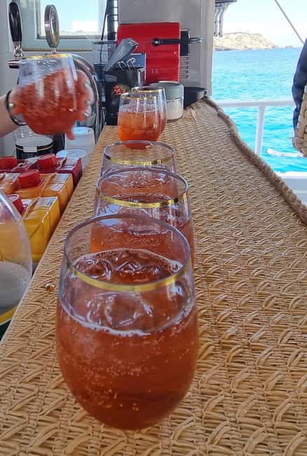 Rhodes: Boat Tour with Snorkeling, Gourmet Buffet & Open Bar - Anthony Quinn Bay: cocktails, dessert, and the movie-bay connection