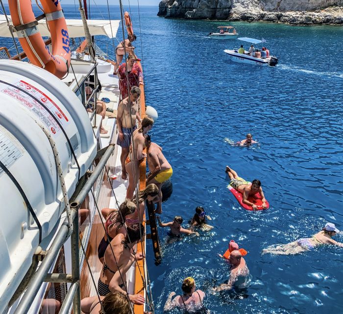 Rhodes: Cruise with 3 Stops, Lunch and Unlimited Drinks - Lunch Buffet, Unlimited Drinks, and Theo Keeping the Day Moving